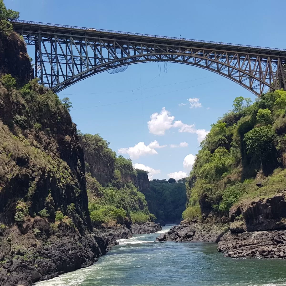 The iconic Victoria Falls Bridge over the Zambezi River. The Bridge links Zambia and Zimbabwe